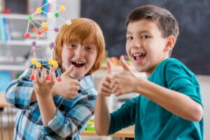 Excited boys complete fun engineering project at school